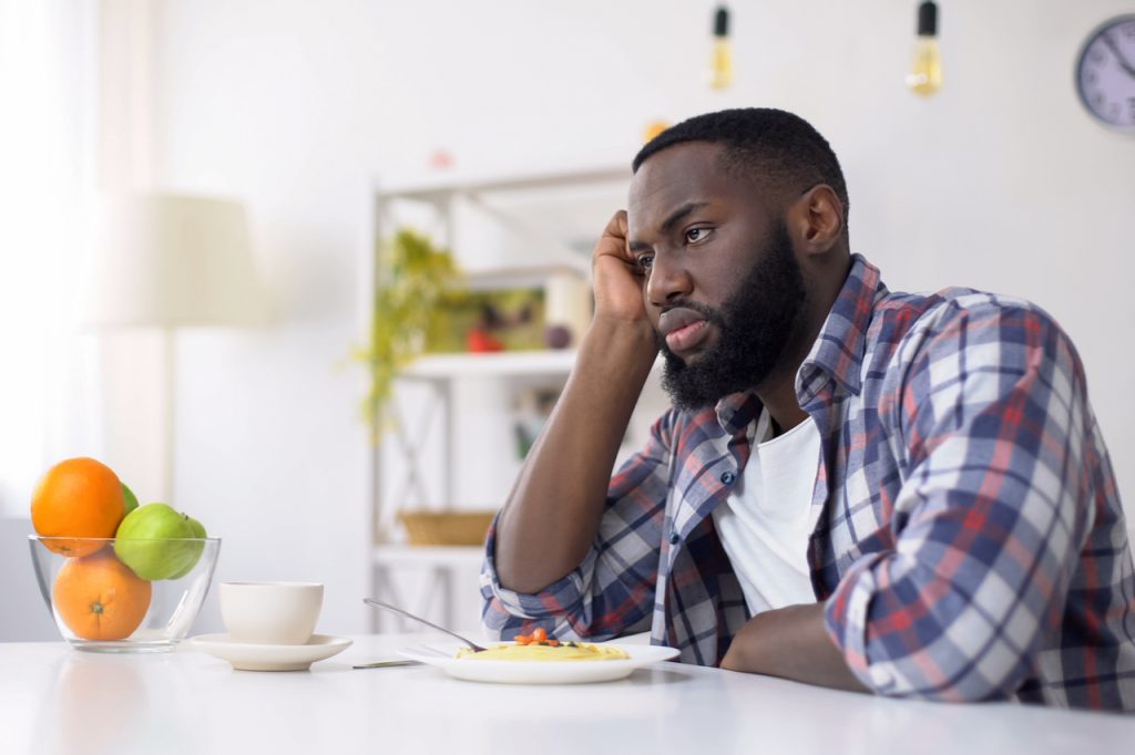 Man having no appetite, eating disorder, depression problem.