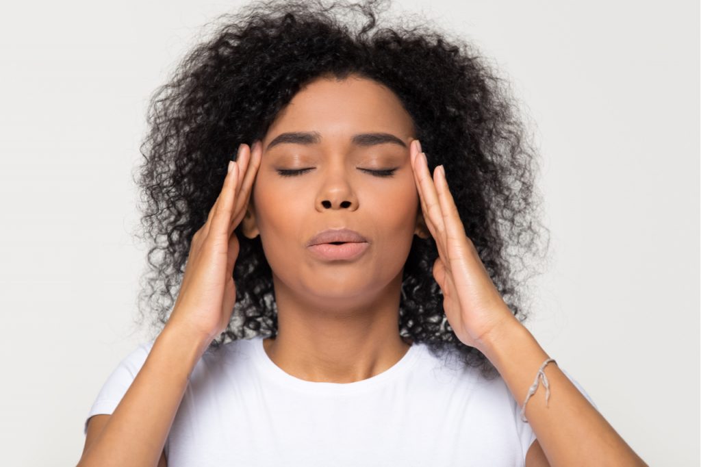 Woman breathing calming down managing stress.