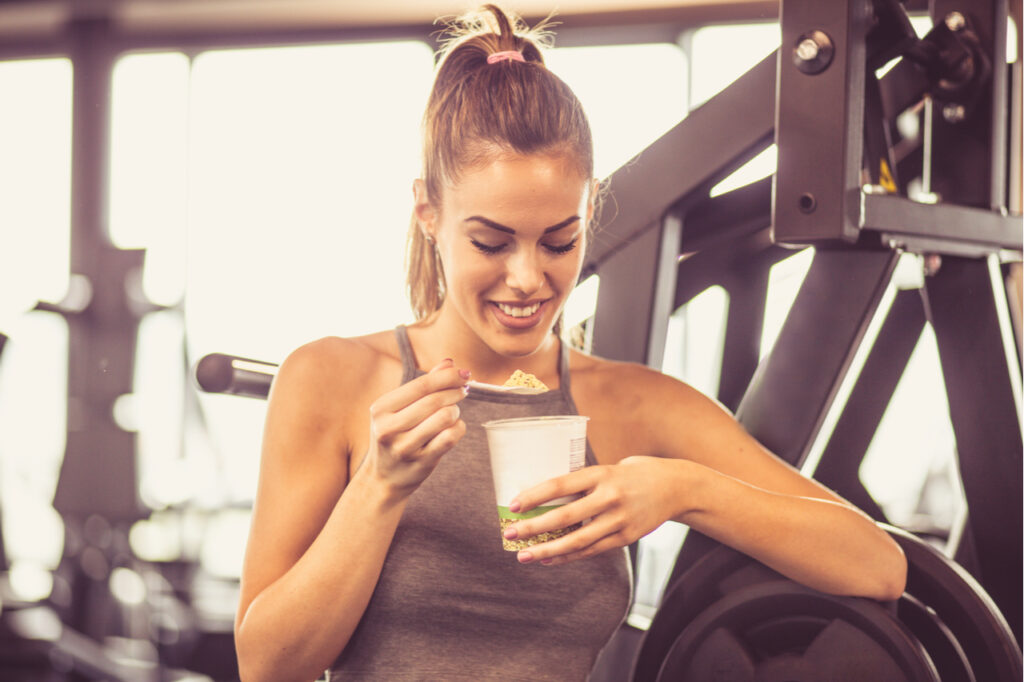 Woman eating a pre-workout snack