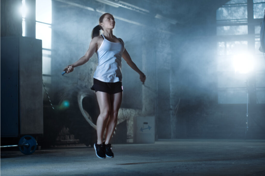 Woman working out with fitness ball.
