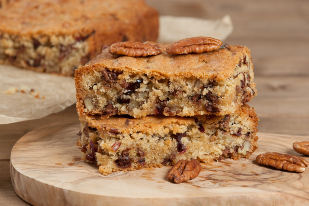 Pumpkin Cinnamon Chip oatmeal bars with pecan nuts on the side.