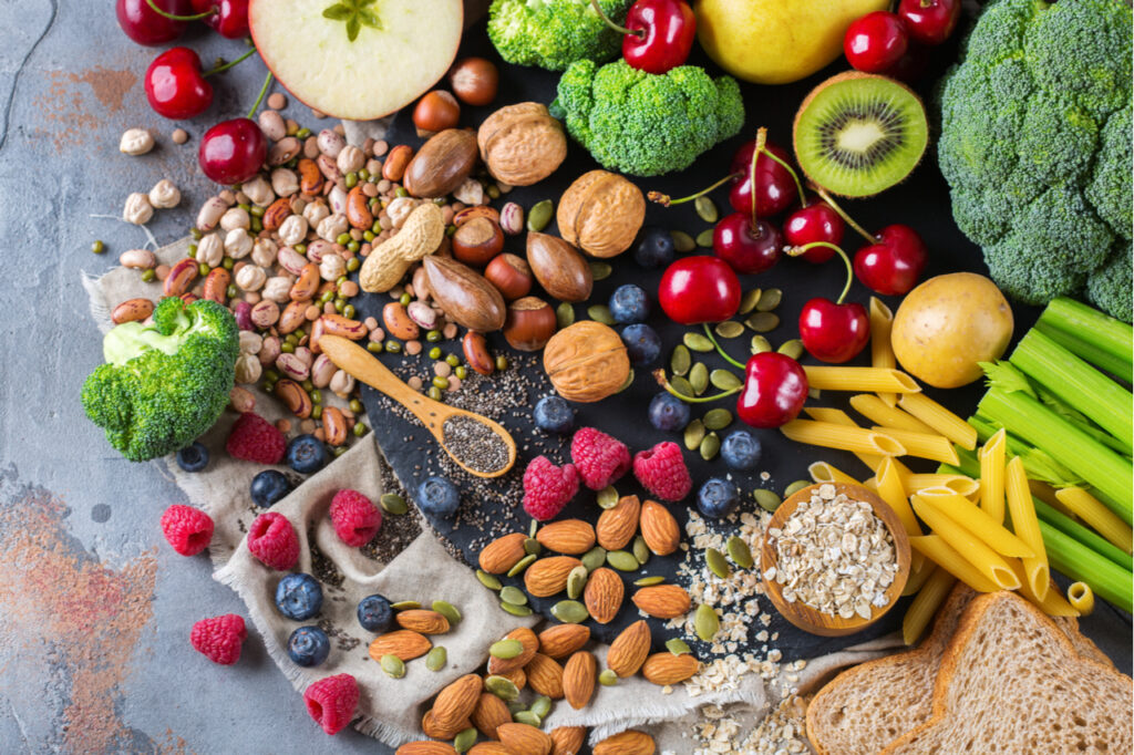 Selection of antioxidant rich foods, like berries, broccoli, nuts, and other fruits.