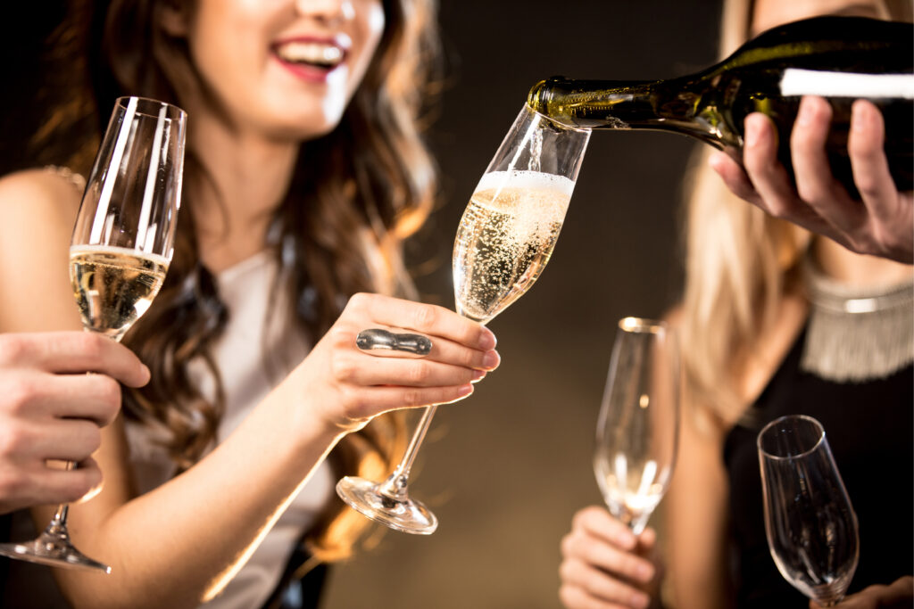 Women drinking champagne.