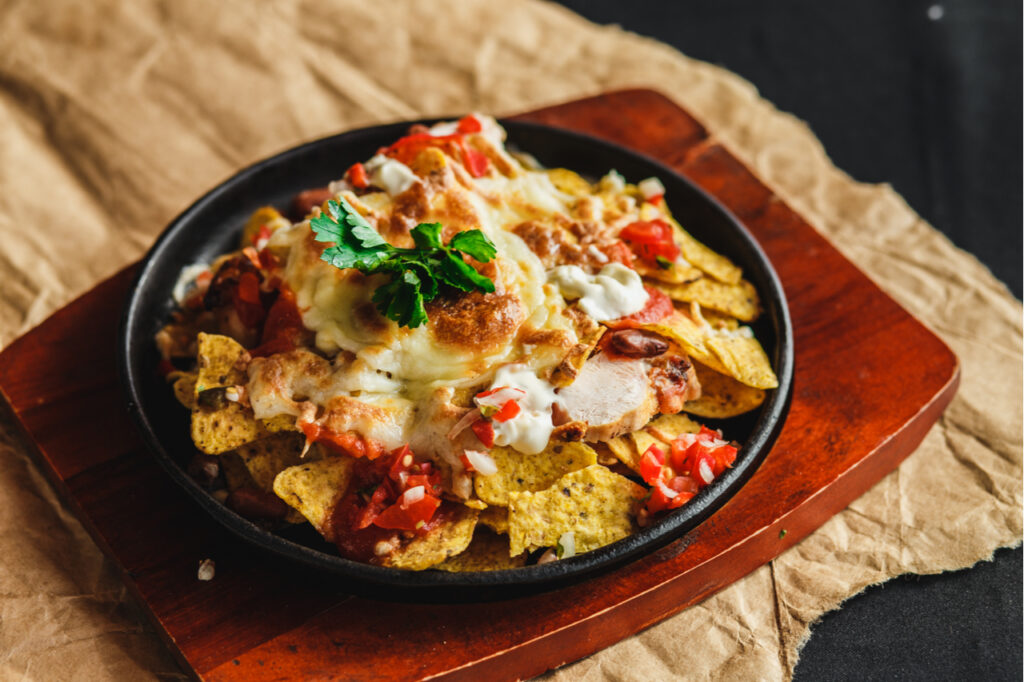 Cchicken nachos on a serving plate.