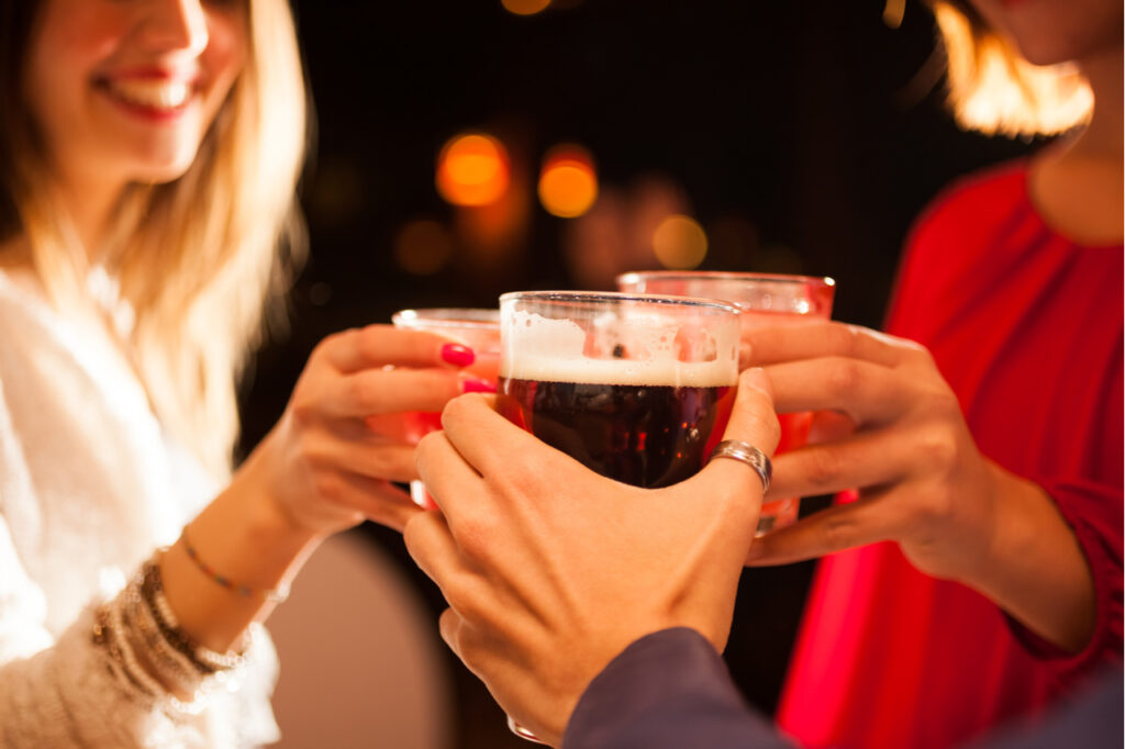 Friends having a round of drinks in a pub