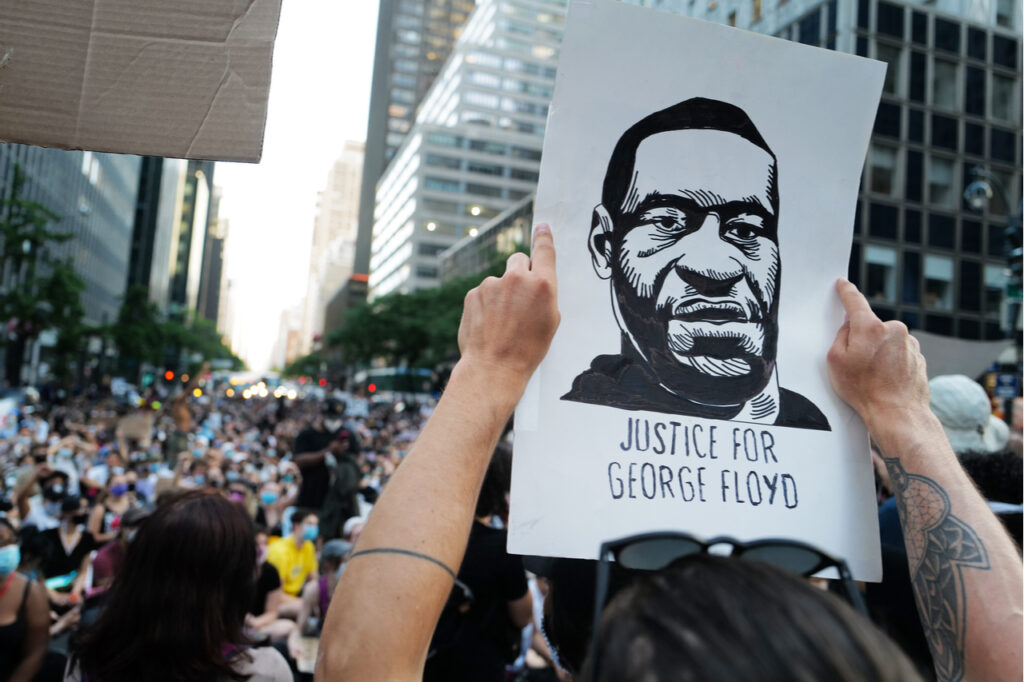 People holding a portrait of George Floyd during the Black Lives Matter Protest.