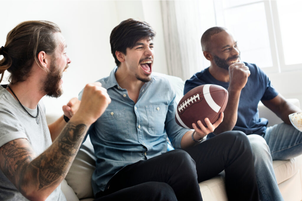 3 men cheering while watching super bowl. What are super bowl snack ideas?