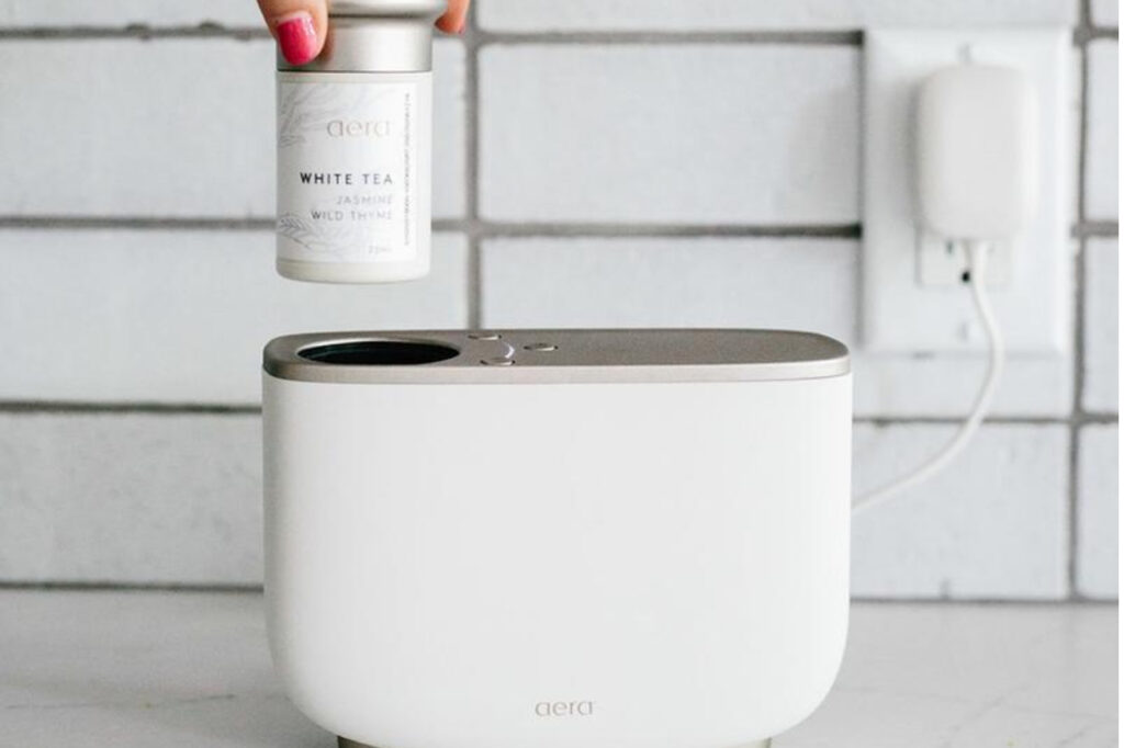 The aera diffuser and a white tea essential oil capsule.