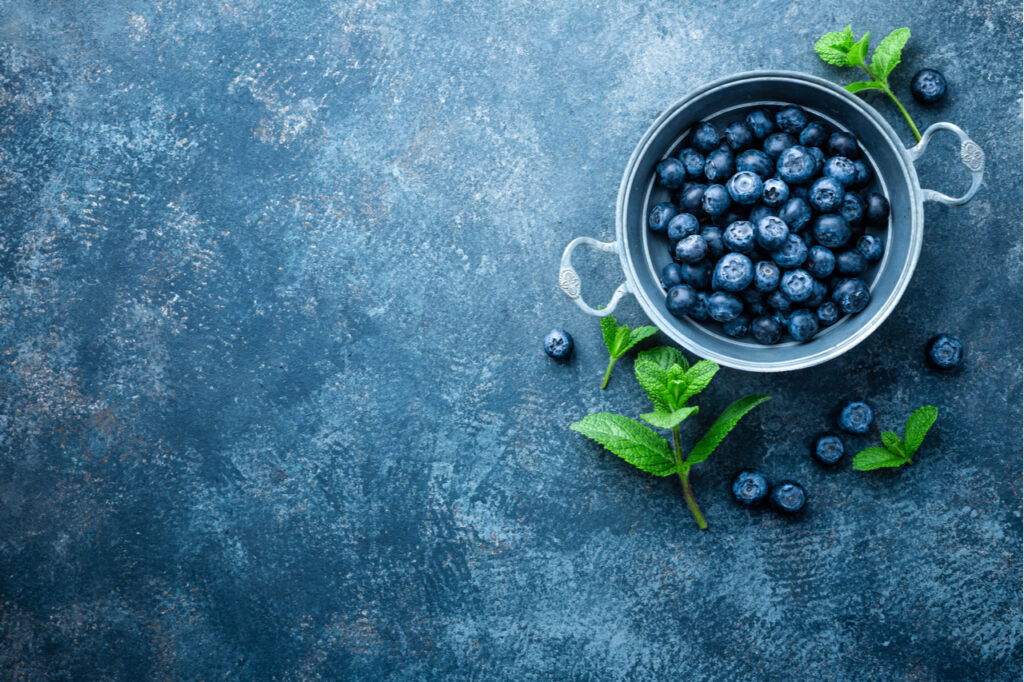 Fresh Blueberries in a bowl on dark background which is the main ingredient of blueberry casserole.