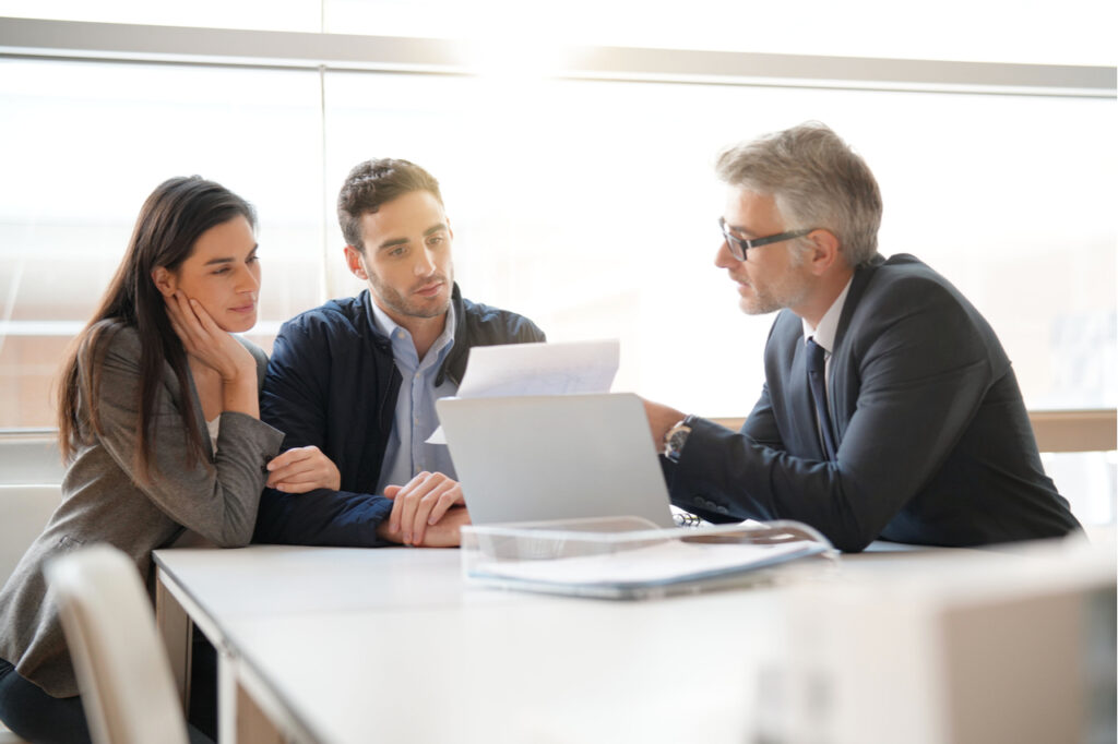 Young couple meeting financial advisor.