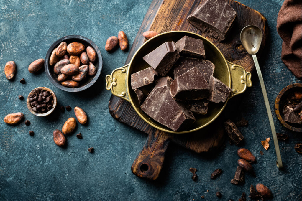 Dark chocolate pieces crushed and cocoa beans.