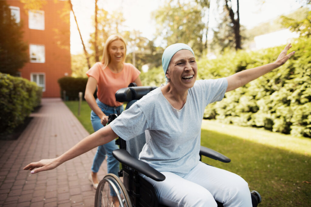 A woman with condition laughing with her daughter.
