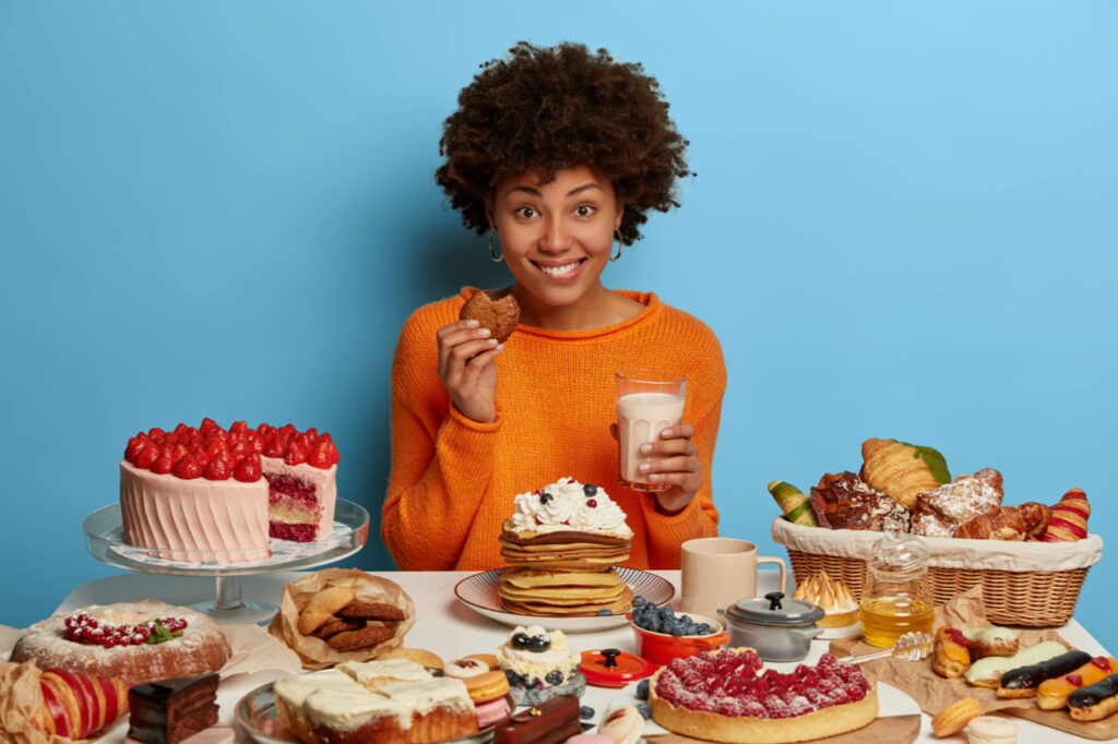 Woman enjoying sweets.