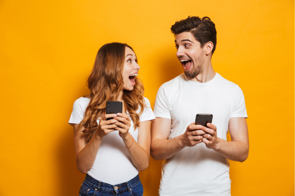 Photo of positive excited people man and woman screaming.