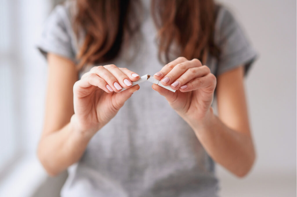 Female quitting smoking cigarettes.