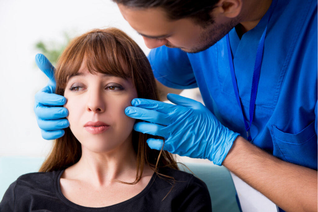Young beautiful woman visiting doctor in plastic surgery concept
