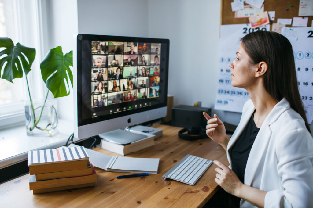 young woman having Zoom video conference call via computer.