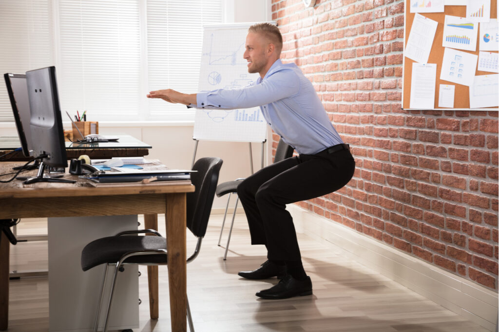 Businessman doing an exercise in the office.