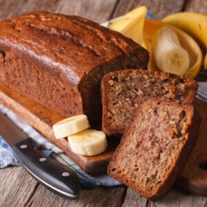 Homemade banana bread sliced on a table close-up