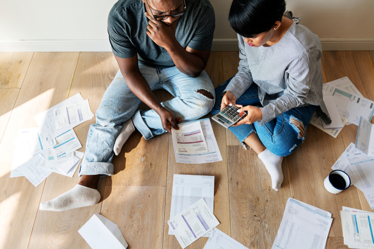 Couple managing the bills trying to get out of debt.