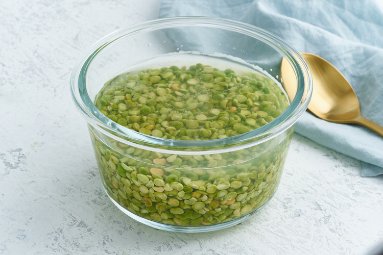 Soaking green peas cereal in a water to ferment.