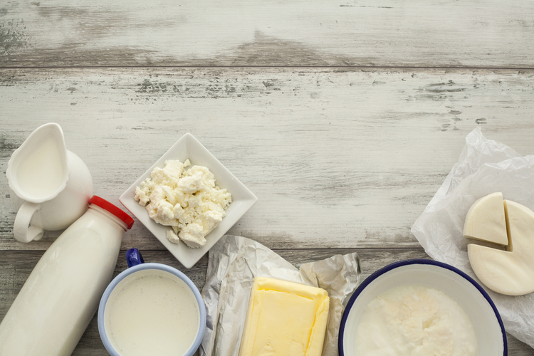 Dairy products on wooden table.