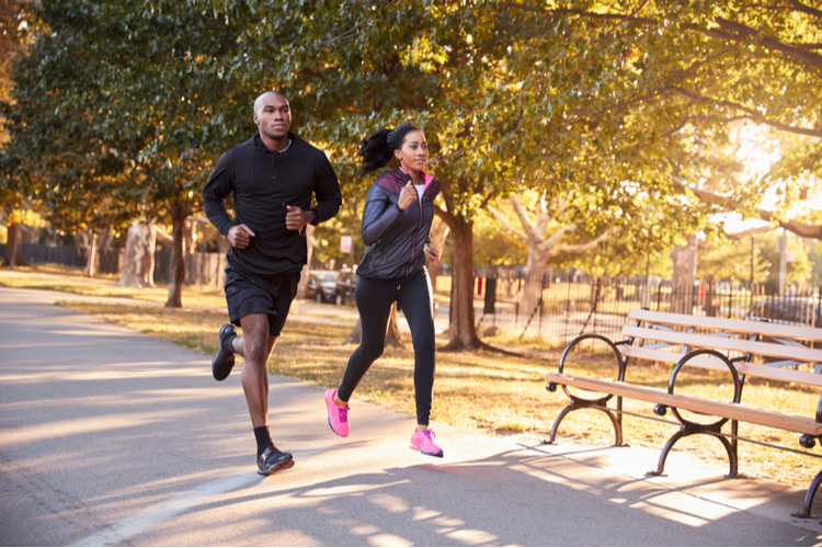 Couple jogging in a park.