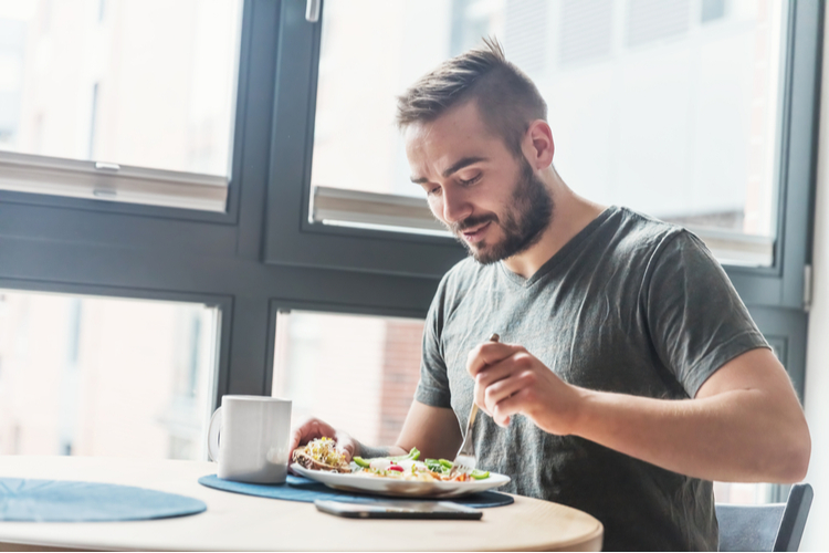 A man eating a healthy morning meal.