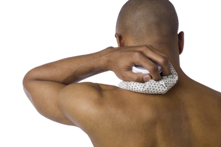 Man using ice treatment for sore muscles after workout.