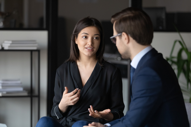 Woman sharing opinion to co-workers.