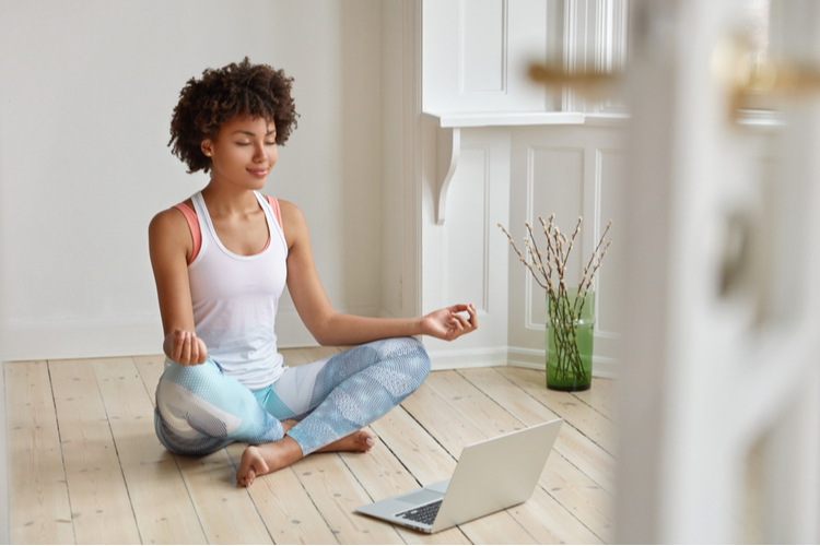 Woman meditating doing yoga.