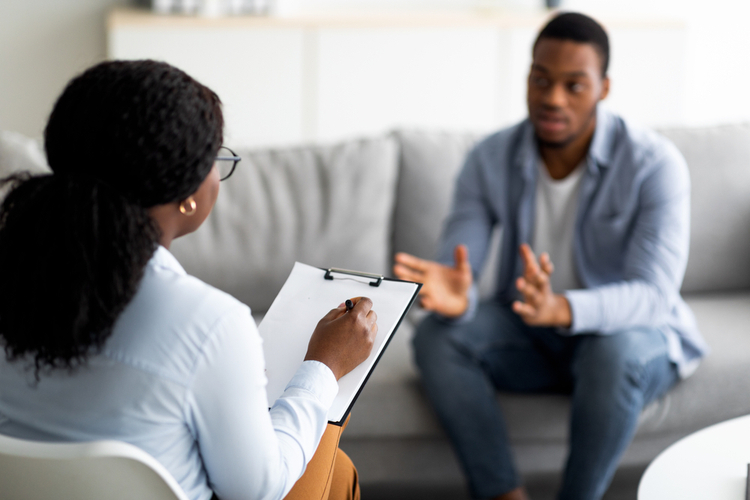 Man with depression having counseling session trying how to find the right therapist.