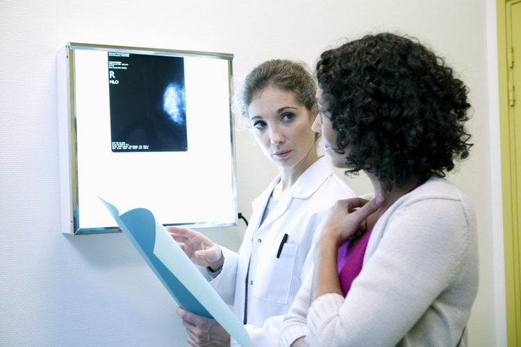 Woman consulting a doctor about her mammogram result.