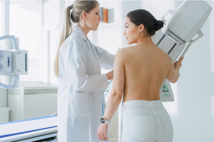 Woman getting a mammogram.