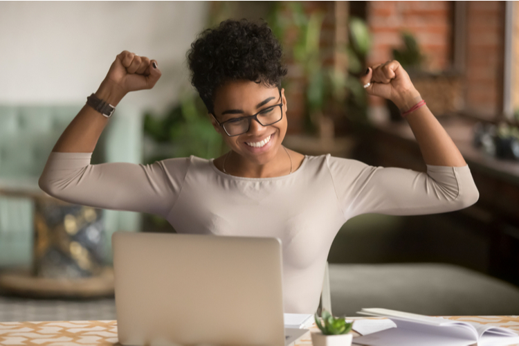 Woman feeling winner rejoicing stay motivated and never gave up.