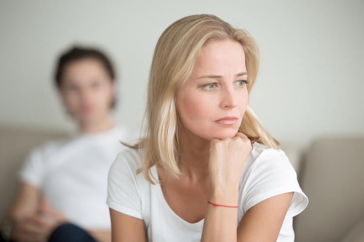 A woman thinking after having an argument with her partner.