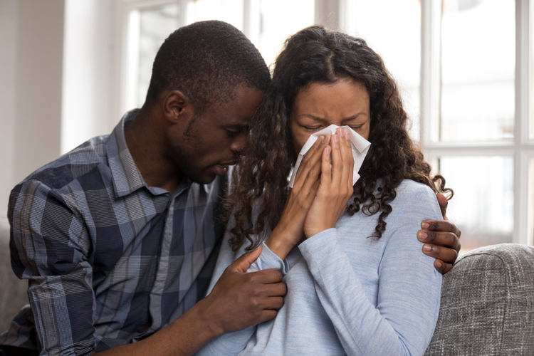 Supportive African Husband Embracing Crying Wife Asking for Forgiveness