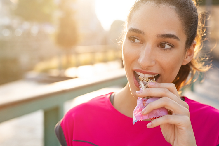 Fitness Beautiful Woman Eating A Energy Snack Outdoor.