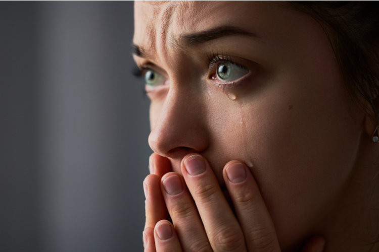 Sad Desperate Grieving Crying Woman With Folded Hands