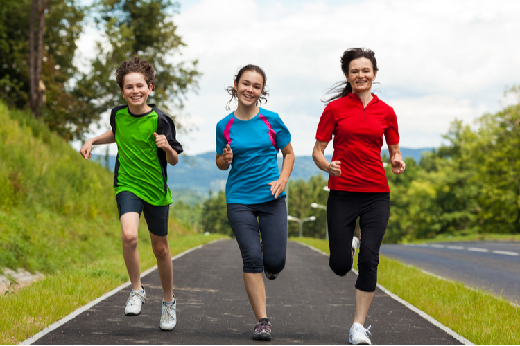 Mother and her kids jogging in the morning.