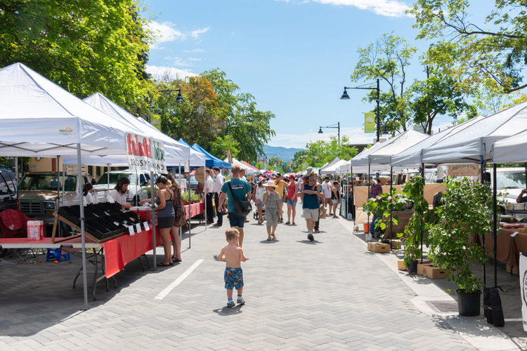 Penticton, British Columbia/Canada - June 15, 2019: vendors and customers line Main Street for the Penticton Farmer's Market