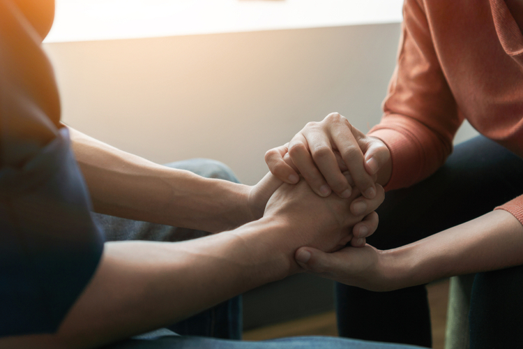 PTSD mens mental health concept, Psychologist sitting and touch hand man for encouragement