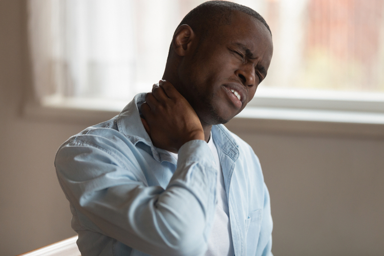 Unhealthy sad black man needs medicine chiropractor help.