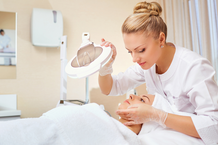 Cosmetologist is a professional with a patient in the office.
