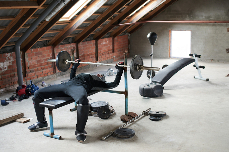 Man doing his workouts at his home gym perfect to have his own bowflex xtreme 2 se.
