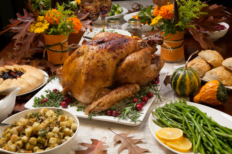 Roasted Turkey Garnished With Cranberries on a Rustic Style Table.