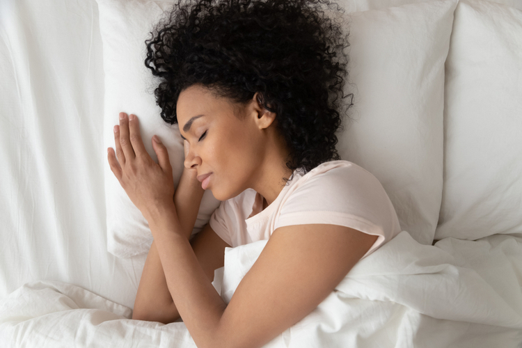 sleeping in comfortable bed top