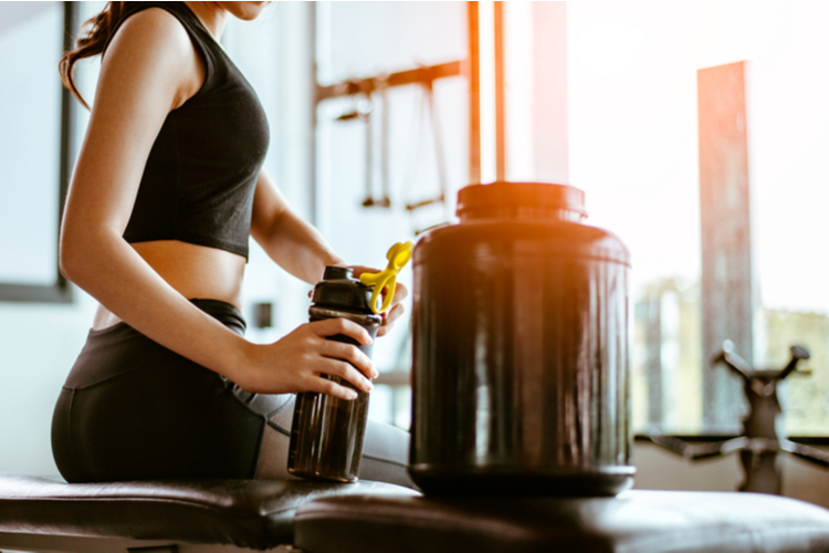 woman brewing protein shake.
