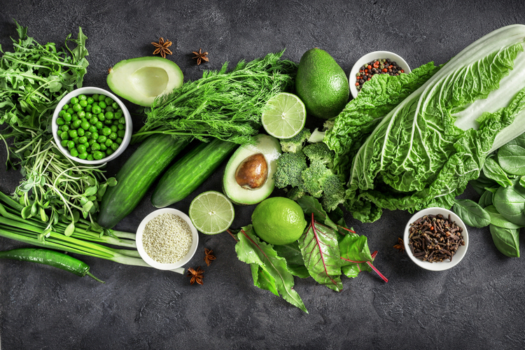 Top view of healthy organic food: green vegetables, seeds and herbs.