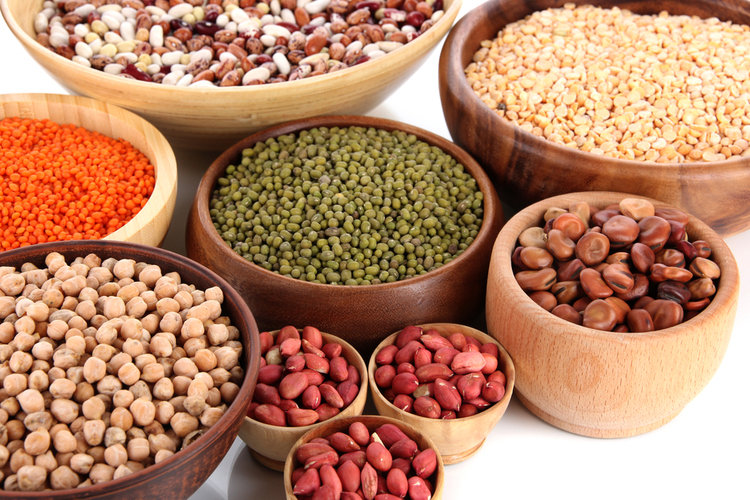 Different kinds of beans in bowls.